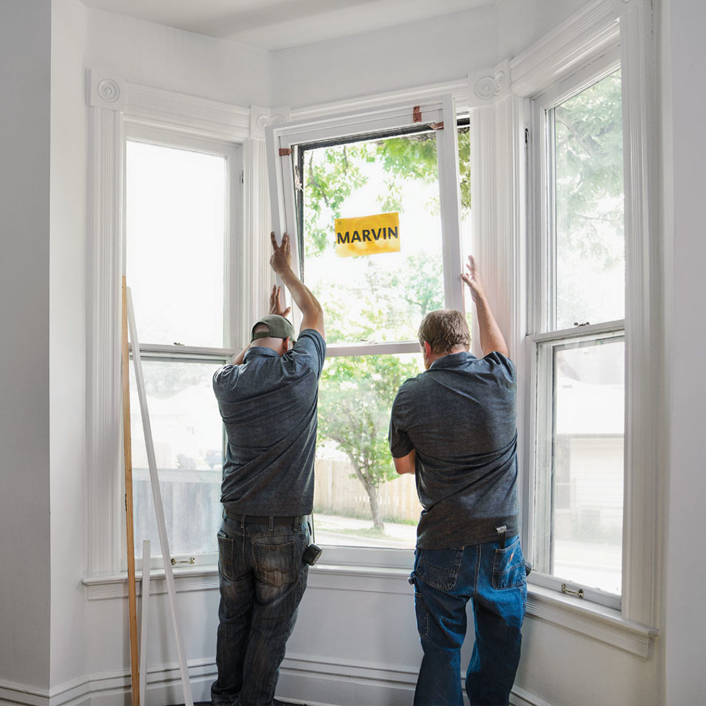 two men installing Marvin windows