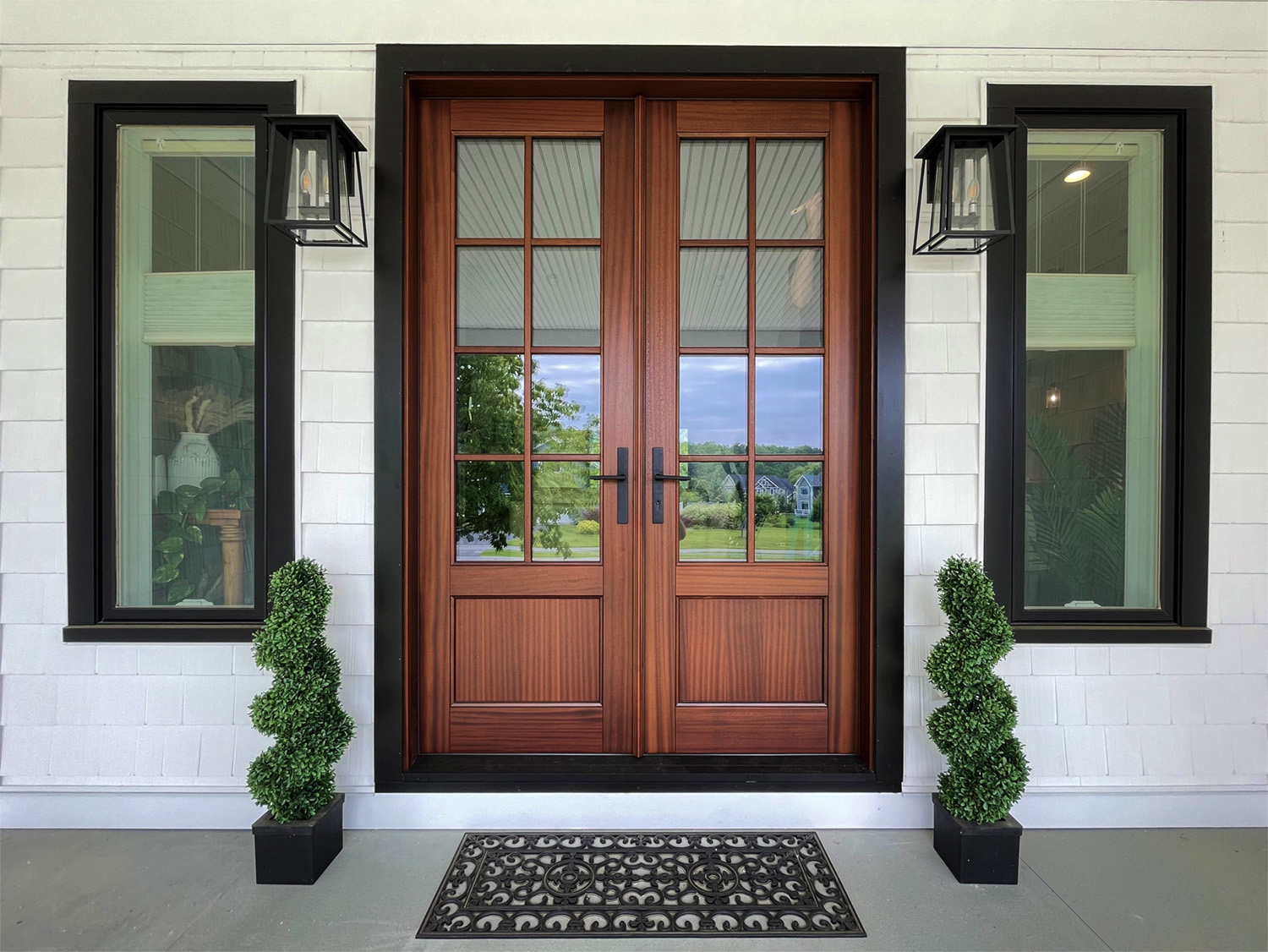 Glenview mahogany front entrance double door installed on house with white siding